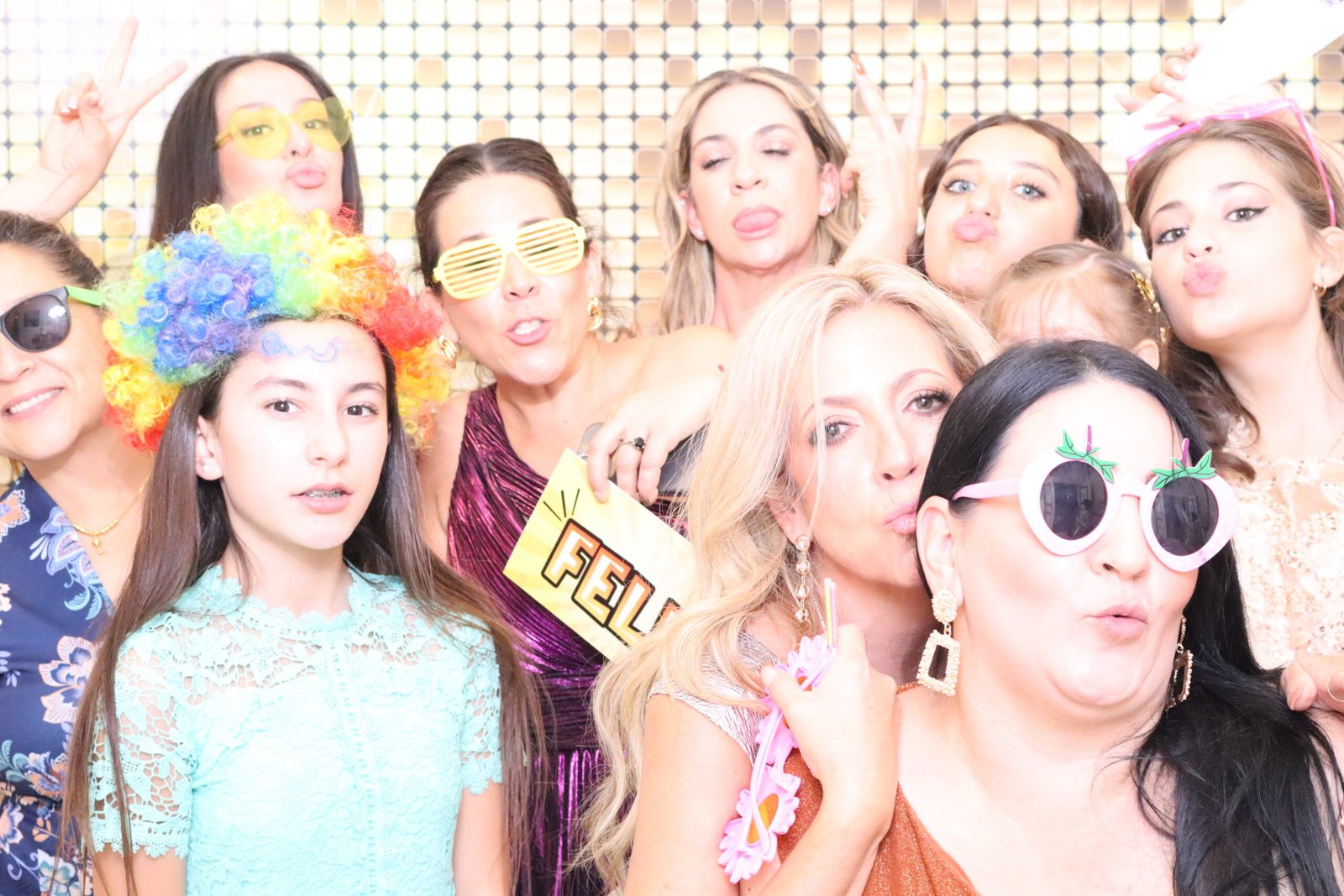 Guests posing with fun props at an Orange County photo booth rental by beÜtiful Pixels