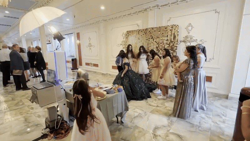 Modern digital photo booth at an event venue, set up for self-serve guest photos, GIFs, boomerangs, and live gallery sharing.