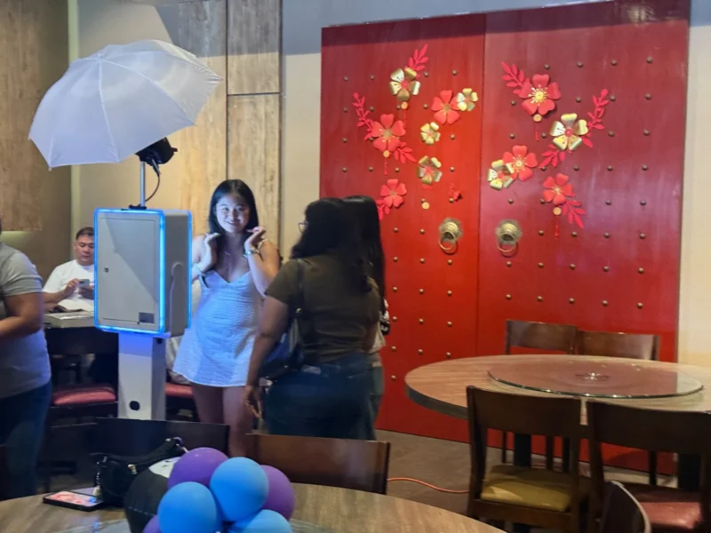 TurnKey-Pro photo booth capturing guests at an indoor Orange County event by beÜtiful Pixels