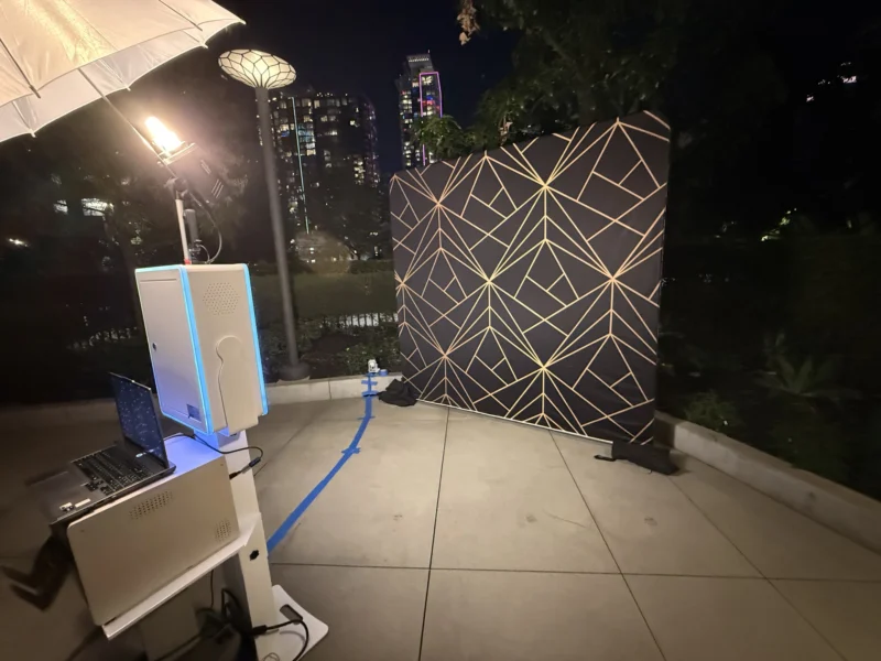 TurnKey-Pro photo booth setup by beÜtiful Pixels in Orange County with a black and gold geometric backdrop at night
