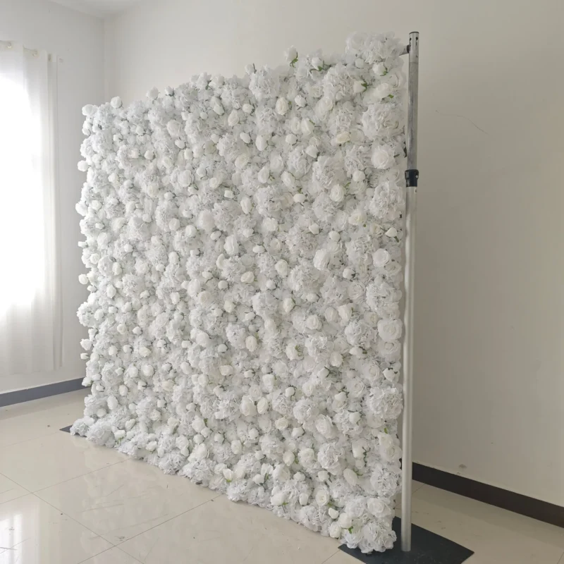 Side angle of white flower wall backdrop for event photo booth setup