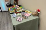 Birthday-themed photo booth props including "Birthday Queen" and "Make a Wish" signs displayed on a table for an Anaheim party.